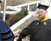 Rick Pangburn accepting his degree